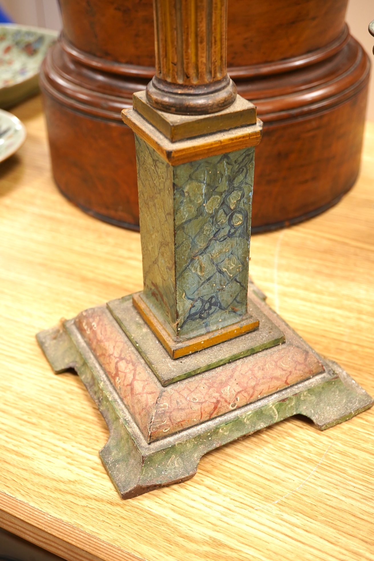 A brass ‘oil lamp’ lamp base and a polychrome painted wood pillar, 75cm